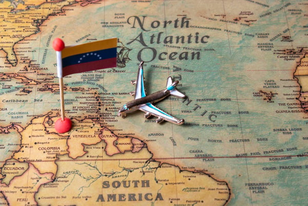 The flag of Venezuela and the plane on the world map.